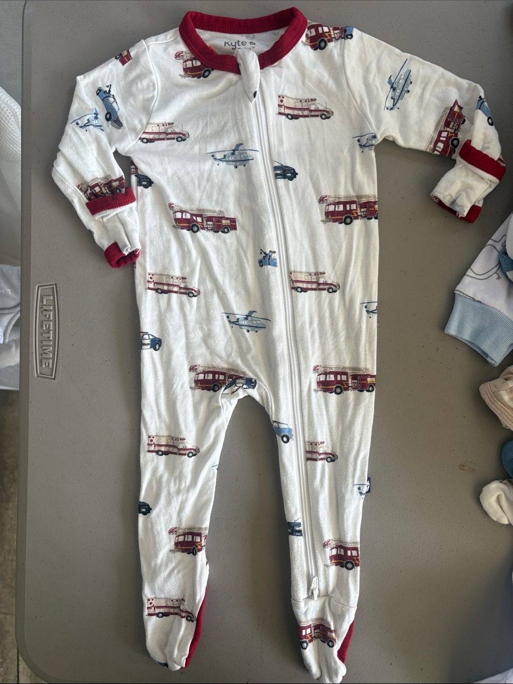 Kyte BABY “Emergency Vehicles” Zippered Footie. Like New. 0-3 mos.
